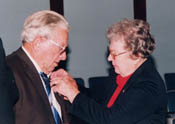 Nana pinning Papa with his 50th year Masonic Pin